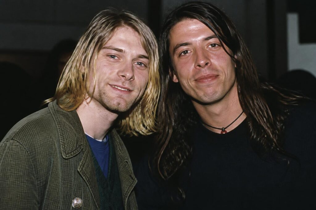 découvrez quel guitariste joue aux côtés de kurt cobain sur la photo originale, une image emblématique du monde du rock.